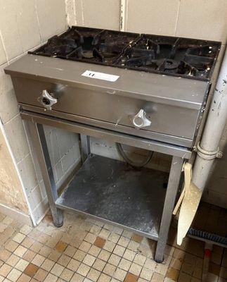 a stove that is sitting in the corner of a room