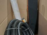 a black hose in the middle of a cardboard box
