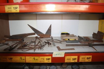 many different types of tools on a shelf