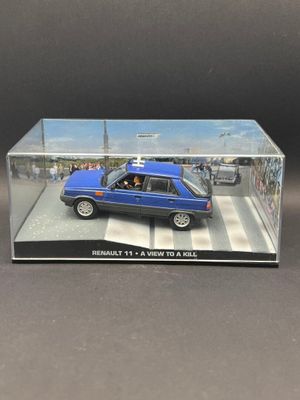 the blue car is in a clear box on the table