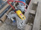 a pile of wires and other electrical equipment on a pallet