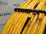 a bunch of yellow wires that are on top of each other