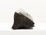 a small piece of chocolate sitting on top of a table