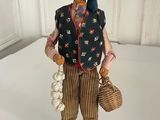 a figurine of an old woman with a basket
