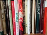 many books that are on a book shelf together