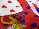 a close up of a red and blue tie with hearts on it