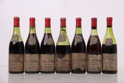 six bouteilles de vin sont alignées sur une table