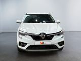 the front view of a white car parked in a showroom