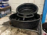 a picture of a metal cart with two black pots on it