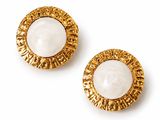 an image of a pair of white and gold earrings