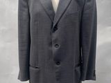 an image of a suit on a mannequin stand