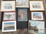 a lot of paintings that are on the floor