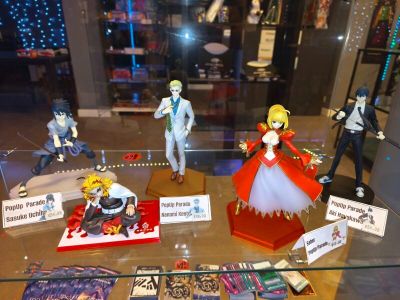 many figurines on display in a glass case