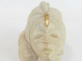 sculpture of a woman ' s head on a white background