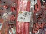 a lot of red plastic straws in a bag