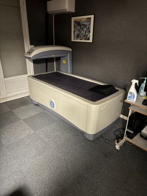 an image of a room with a bed and a table