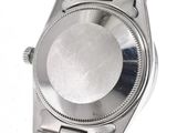 a watch that is sitting on a metal bracelet