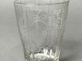 a glass cup that is sitting on a table