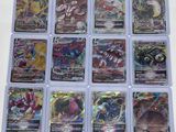a close up of a bunch of pokemon cards on a table