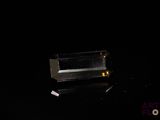 a glass box that is sitting on a black surface
