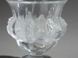 a clear glass vase with a design on it