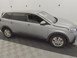 a picture of a silver car parked in a garage
