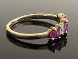 an image of a gold ring with pink and white stones