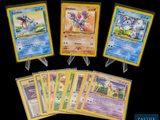 four different pokemon cards are shown in a row on a black background