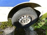 a close up of a tire on a yellow car
