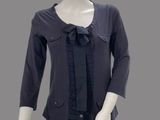 a mannequin wearing a black top and black pants