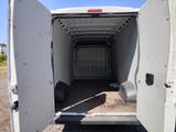 a white van with a door open on the side of the road