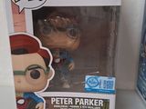 two pop vinyl figures of peter parker and spider - man in a box