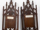 pair of antique wooden framed mirrors with crosses on them