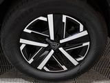 a close up of a tire on a black car