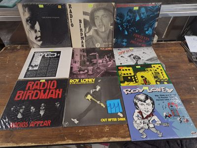 a lot of records on a table in a room