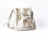 a white bag that is sitting on a white surface