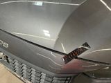 a sticker on the hood of a silver car