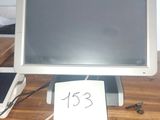 a computer monitor sitting on top of a wooden desk