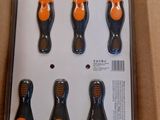 six screw screwdrivers in a package on a table