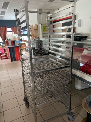 a metal rack with food on it in a kitchen