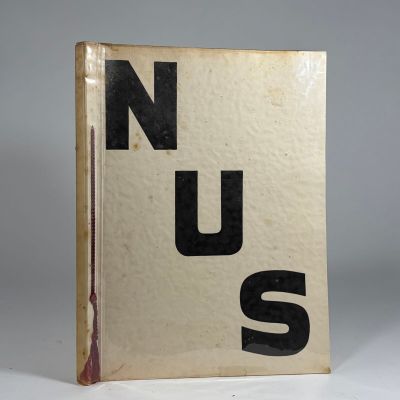 a book with the words nus on it sitting on a table