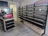 a large display of makeup products in a store