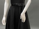 the mannequin is dressed in a black dress with sequins on the shoulders