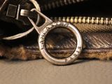 a close up of a purse with a keychain in it