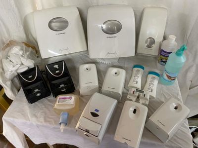 a table with a lot of electronic items on top of it