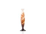 a vase that is sitting on a stand on a white surface