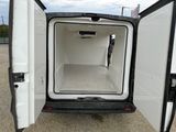 a white van with its door open in a parking lot
