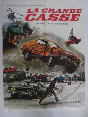 On voit l'affiche du film « La Grande Casse ».