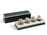 three salt and pepper shakers in a box