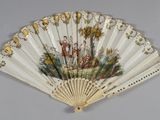 a fan with a painting on it hanging on a wall
